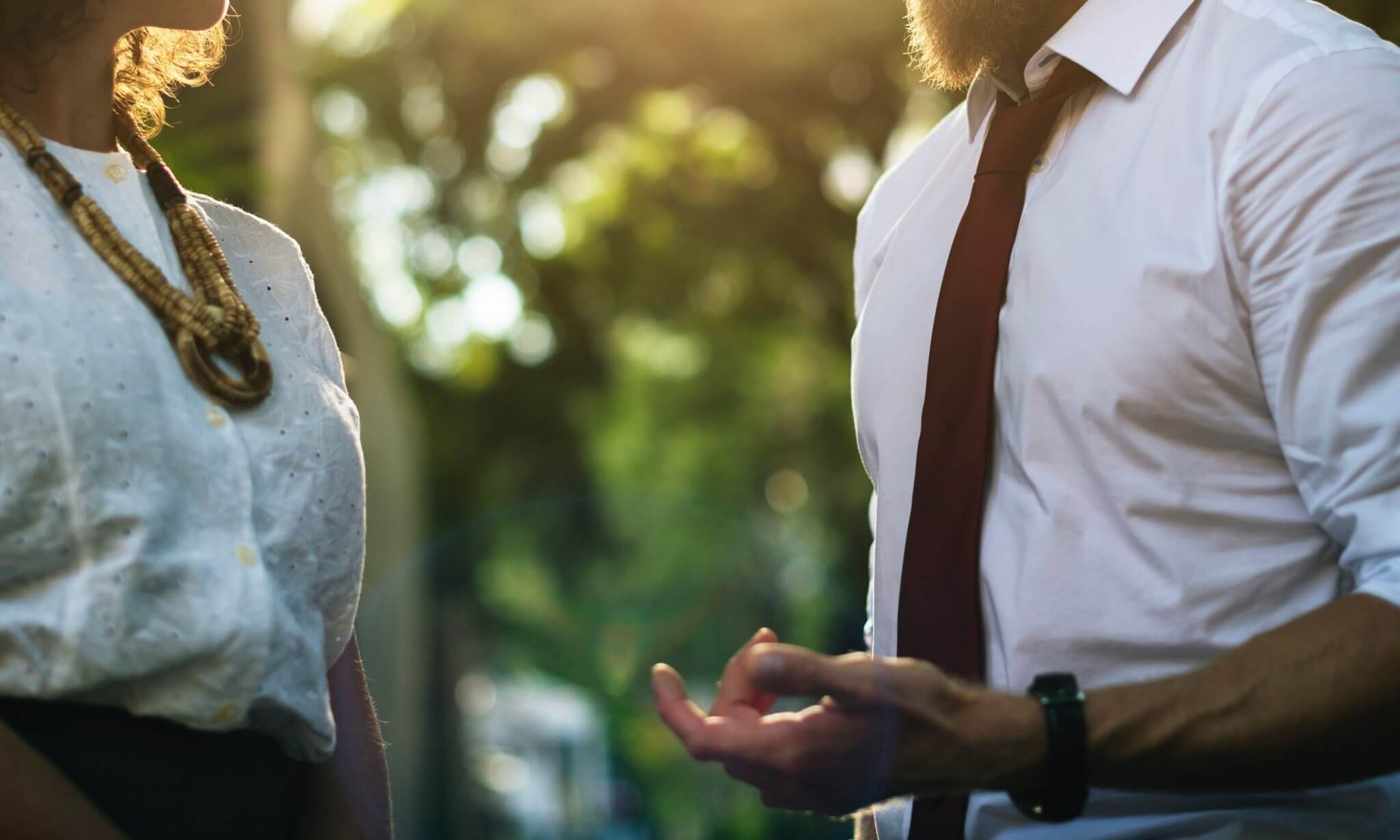 Two people talking to each other in a neutral environment. Two people talking to each other in a neutral environment.