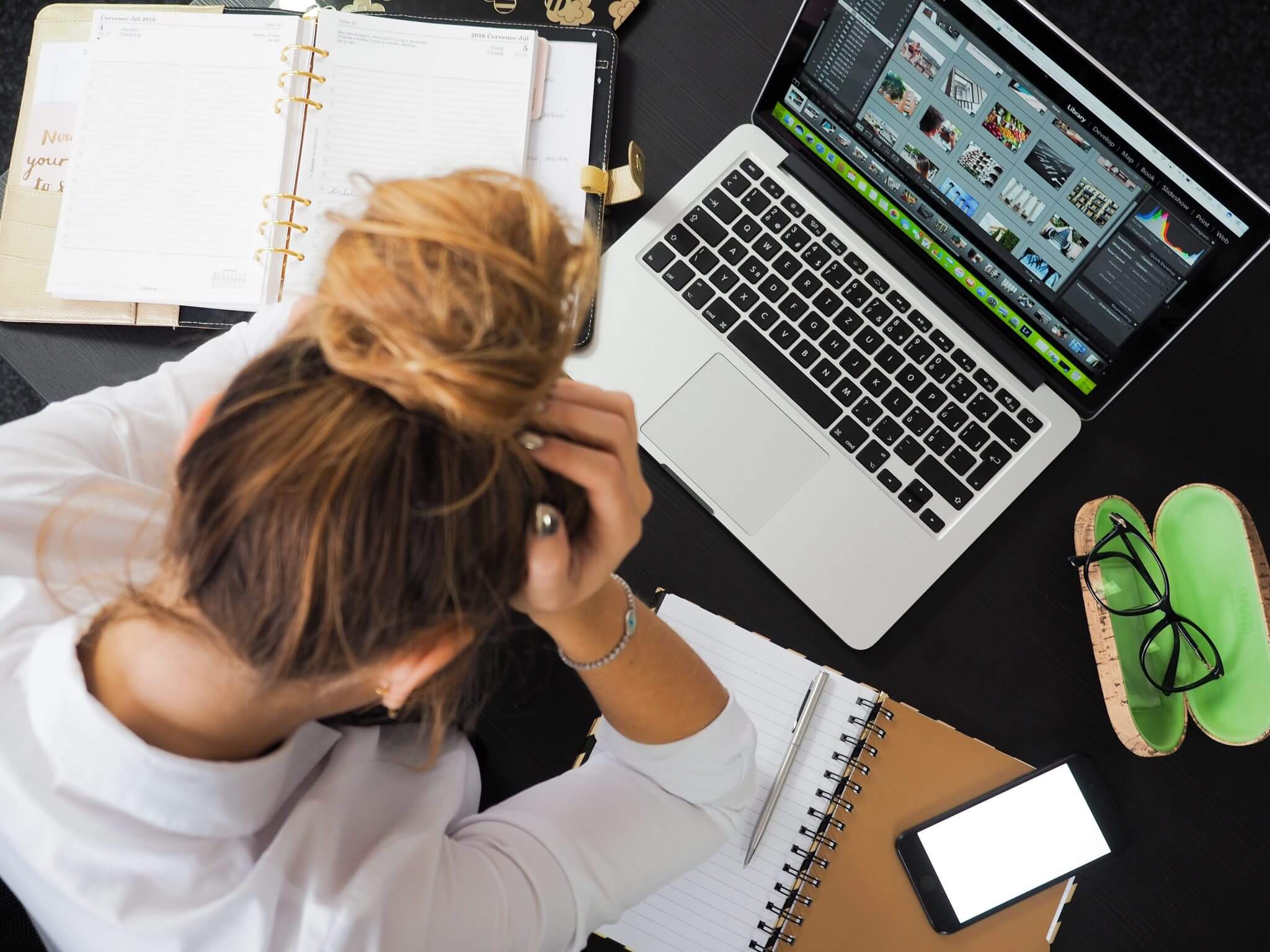 stressed out employee staring at her computer stressed out employee staring at her computer