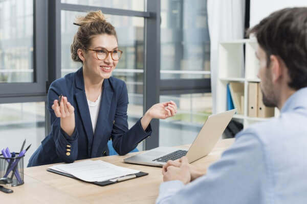 A female manager doing a performance management evaluation.