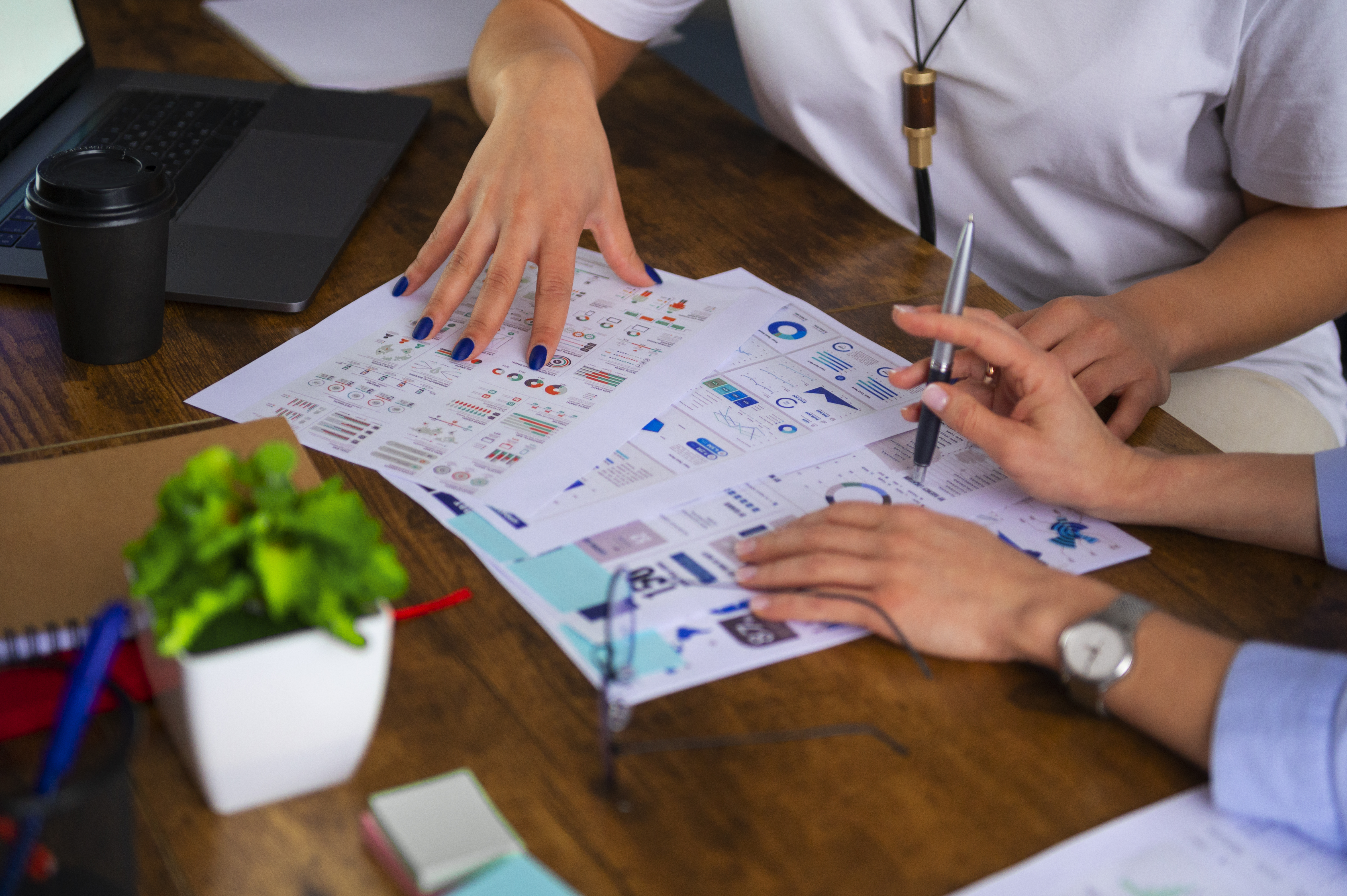 women-working-together-office-high-angle