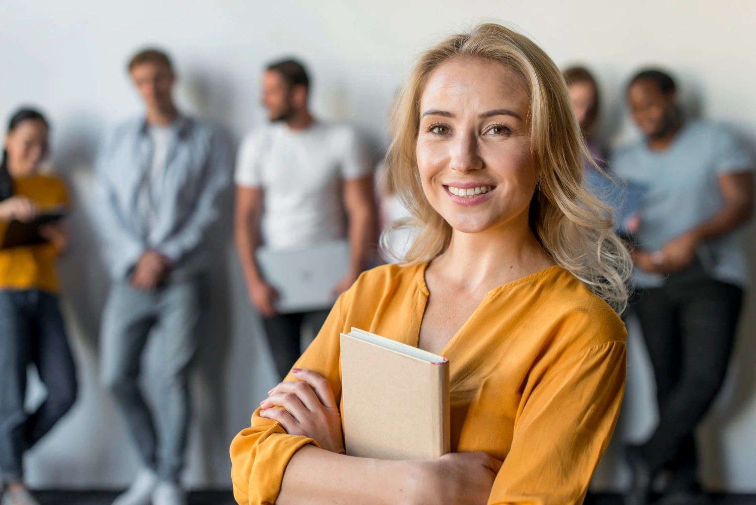 Smiling HR leader representing confidence and learning in recruitment courses and online courses for recruiters focused on talent assessment and hiring skills.