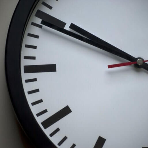 Picture of a clock taking up the whole frame, pointing to 10:50.