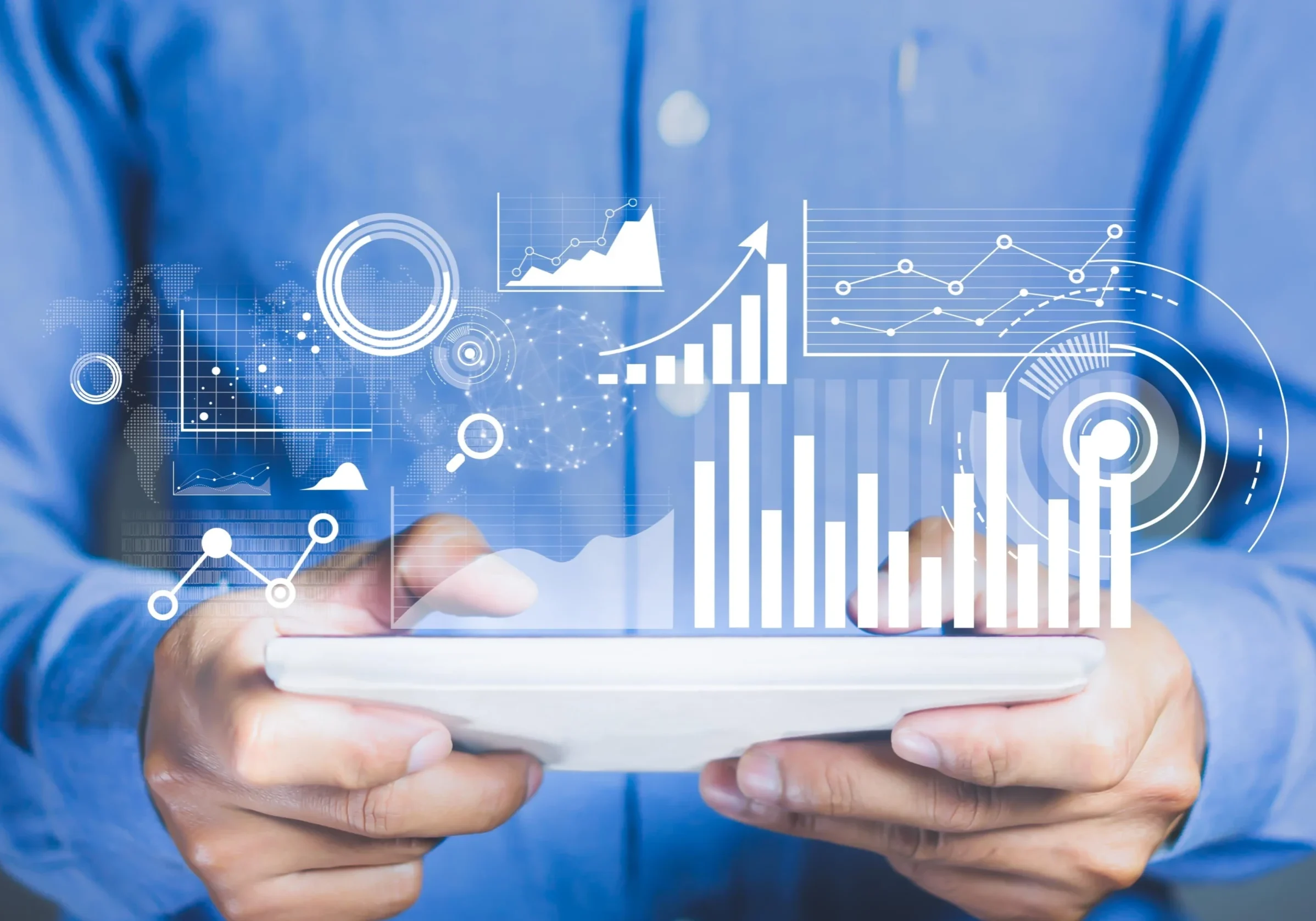 Close-up of hands holding a tablet with futuristic assessment dashboards and graphs for skills evaluation, test results, and performance analysis.