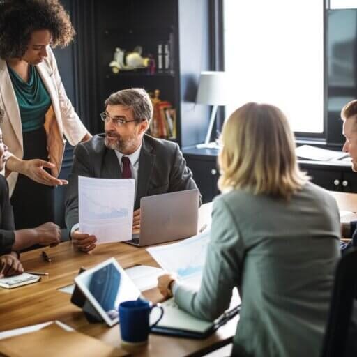 Employees reviewing their hiring process