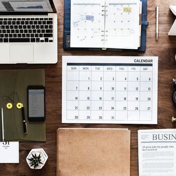 desk with calendar and documents.